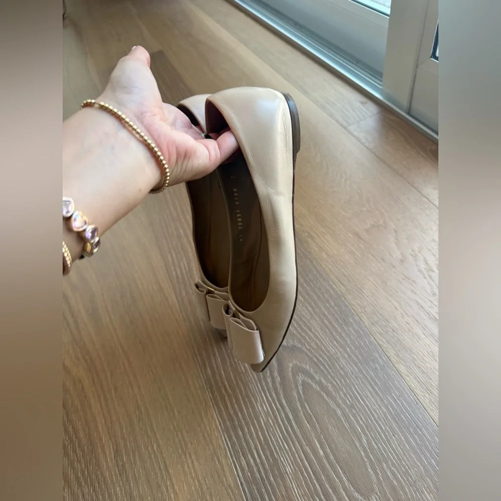 Salvatore Ferragamo Cream Flats with Bow Accent